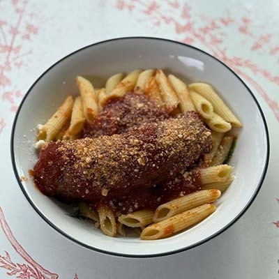 Al dente pasta served with savory Italian Sausage simmered in our signature sauce, finished with a sprinkle of Parmesan.