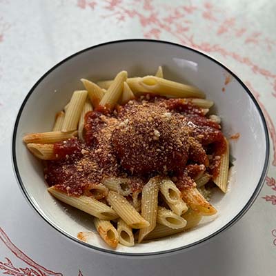 Tender pasta topped with our signature sauce and housemade meatballs, garnished with Parmesan Cheese